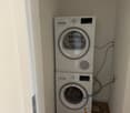 Stacked Siemens washing machine and dryer, hardwood floor