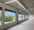 large windows, white walls, white ceiling, tiled floor, view of mountains and trees
