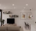 Spacious living room with large windows offering a scenic view, modern minimalist decor with neutral colors, floating shelves displaying decorative items, TV mounted on the wall, dining table and chairs in the adjacent area