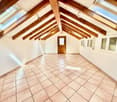 attic room, wooden beams, tiled floor, skylight windows, door