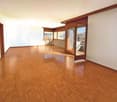 empty room, wooden floor, sliding doors, windows, balcony outside