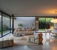 spacious room with sliding glass walls, sofas, coffee table, dining table, chairs, lamp, carpet