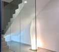 Contemporary design, modern staircase, glass partition, sleek finish, modern lighting