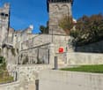 castle, stone walls, staircase, railings, tower, green lawn