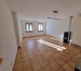 empty room with tiled floor, 2 windows, fireplace