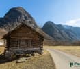 wooden cottage on the mountainside, old wooden door, gravel driveway
