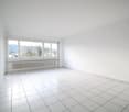 empty room, white tiles, white walls, large window, white radiator