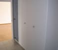 white wardrobe with open door, wooden floors, tiled floors