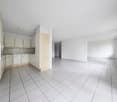White tile flooring, wooden cabinets, white appliances, spacious room