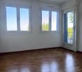 empty room, three windows, wooden floor, sliding door, balcony