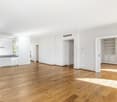 empty room, wooden floors, white walls, large windows, kitchen island