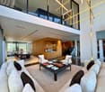 open floor plan, modern design, double height ceiling, L-shaped couch, glass window, dining area, glass balcony