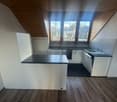 kitchen with island, granite countertops, wooden cabinets, dishwasher, oven, sink, large windows
