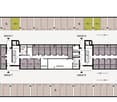 two identical buildings each with 9 floors, shared staircases, common areas, elevators, designated parking spaces, emergency exits, and ramps for accessibility