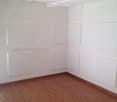 Empty room, wooden floor, white walls, ceiling