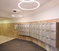 marble walls, round lamps, carpeted floor, storage boxes