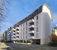 Multi-story building, multiple balconies, underground garage