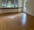 Spacious room, hardwood floors, large windows, balcony