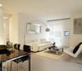 Modern white interior, large white sofa, mirror, glass coffee table, floor lamp, TV