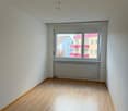 empty room, wooden floor, white walls, large window, radiator
