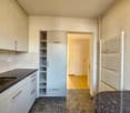 Kitchen, sink, counter, cabinets, shelves, white cabinets, wooden floors