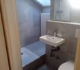shower, sink, toilet, radiator, skylight