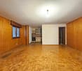 empty room, wooden floors, wooden walls, kitchen in the corner, windows