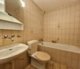 Bathroom with a sink, toilet, and bathtub