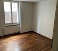 empty room, wooden floor, white walls, window, radiator