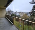 empty balcony, metal railing, tree, playground, garden, grass, clear sky, houses