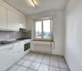 modern kitchen with white cabinets, tiled floor, stainless steel sink, electric stove, oven, window with view