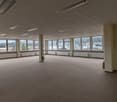 Large open space, white walls, ceiling, and floor, lots of windows, and outside view
