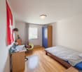 single bed, study desk, wardrobe, chair, lamp