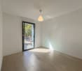 empty room, white walls, wooden floor, sliding glass door, pendant light
