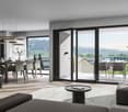 Modern living room, open to dining room and balcony, wooden flooring, large windows, modern lamps