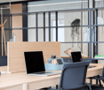 wooden desk, chairs, laptop, organizer, small speaker, shelves, book
