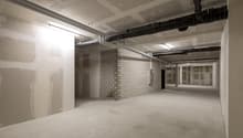 bare room, unfinished walls, exposed pipes, no furnishings