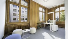 modern office, white desk, office chair, white shelves, plants, carpet floor, large windows, view of city buildings