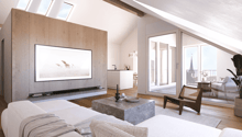 Living room with sky windows, large flat screen TV, white couch, white coffee table, white carpet, glass sliding doors