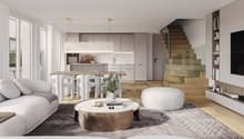Open floor plan with living room, dining area, kitchen, and staircase.