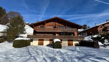 wooden chalet, large balcony, multiple levels, snow covered ground