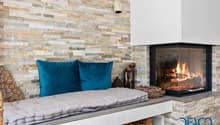 stone wall, fireplace, cushions, decorative elements