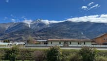 Mountain view, house, road, greenery, mountains in the background