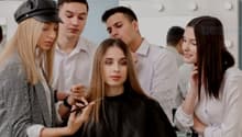 An interior image of a beauty salon with clients getting their hair done.