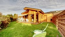wooden house, terrace, garden, lawn, outdoor dining table and chairs