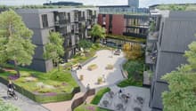 Buildings with balconies, courtyard area with benches and a small park with trees, central open space with people