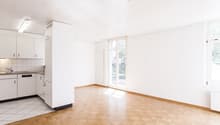 empty kitchen, white walls, wooden floor, open door, balcony