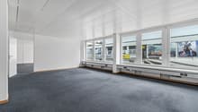 empty room, white walls, grey flooring, large windows