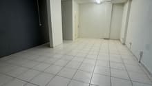empty room, white tiles, white walls, ceiling lights, door, power outlets