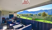 chairs, table, railings, outdoor storage boxes, mountains view